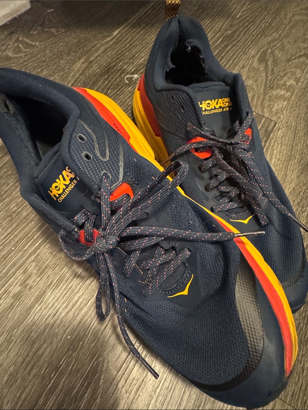 Hoka Men's Navy Athletic Shoes with Red and Yellow Accents